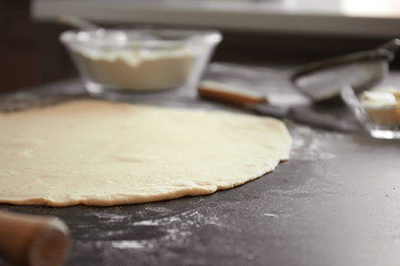 Raw dough on kitchen table. Baking workshop