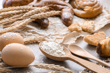 Spoon with flour and eggs. Bakery food