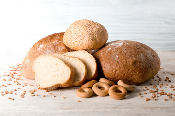 Fresh tasty bakery products on wooden table