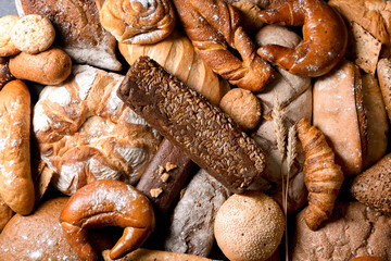 Different bakery products as background, top view