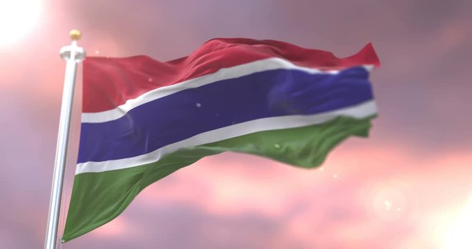 Flag of Gambia waving at wind in slow at sunset, loop