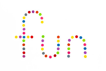 multi coloured fun letters on white background with copy space
