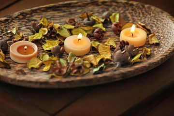 Burning candles on table in spa salon