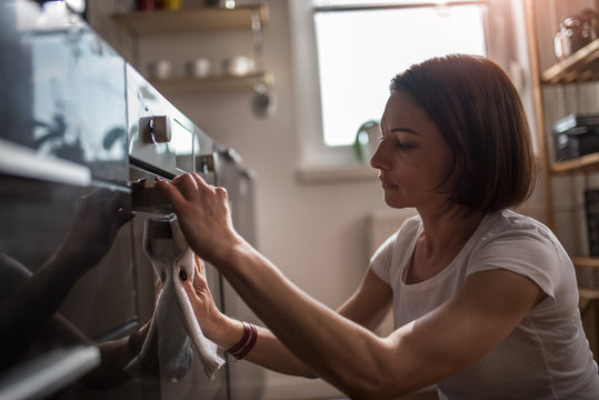 Woman Cleaning Kitchen