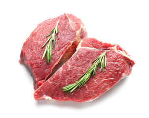 Raw meat with rosemary on white background
