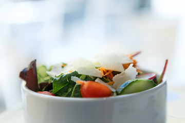 Served salad in a white plate.