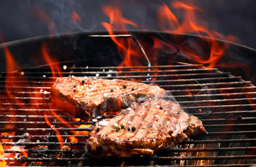 Delicious cooked meat on barbecue grill
