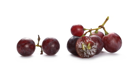 Cardinal grapes with halved slice isolated on white background
