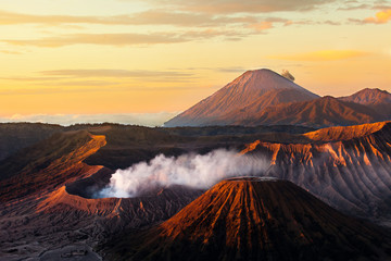 Fototapeta na wymiar Beautiful Vibrant Bromo volcano at sunrise,Tengger Semeru National Park, East Java, Indonesia,panorama view. Morning,.