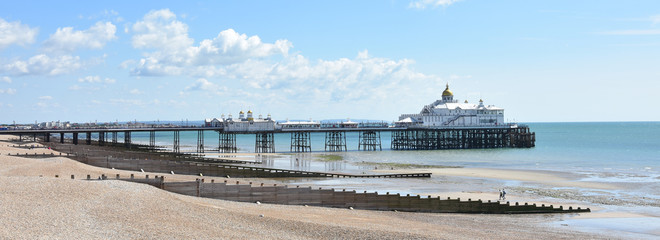 Eastbourne pier and beach, East Sussex, UK on a sunny summer day