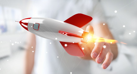 Businessman holding and touching a rocket 3D rendering