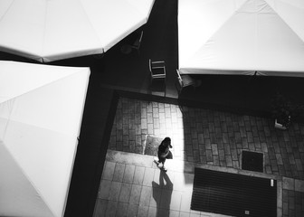 Young man walks in shopping mall square,  Biella, Italy in July 15, 2018