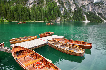 Empty boats in Lake Braies, popular travel destination in Dolomites, Italy
