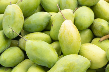 pile of green thai mangoes fruit