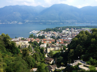 Fototapeta na wymiar Locarno City Top View, Lago Maggiore and mountains landscape on a summer day, Ticino, Switzerland