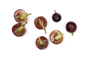 Cardinal grapes with halved slices isolated on white background, top view