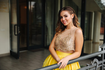 Happy smiling woman in amazing evening dress