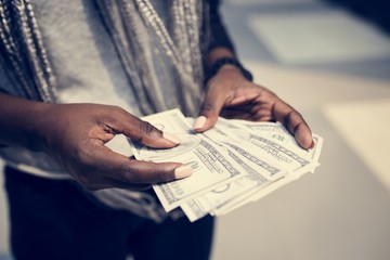 Fototapeta na wymiar Hands holding a dollar bills
