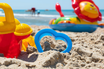 Fototapeta na wymiar Beach sand sea toys for modeling sand summer sun rest
