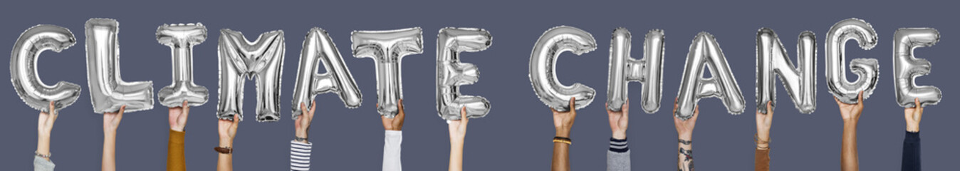 Hands showing climate change balloons word