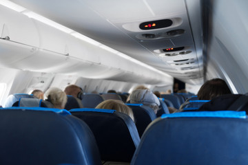Interior inside of the plane with passengers.