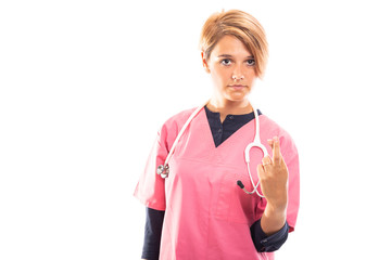 Portrait of female vet holding fingers crossed.