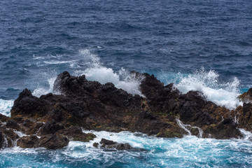 Waves crashing against a rocky coast in Atlantic ocean