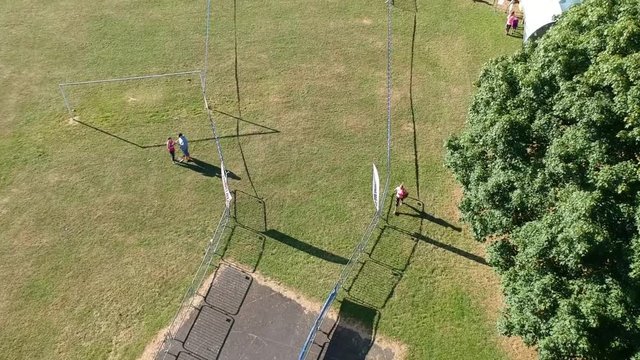 Moving aerial shot along a race track charity event