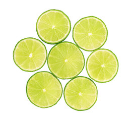 Fototapeta na wymiar Fresh limes green slice with leaves isolated on white background, with clipping path