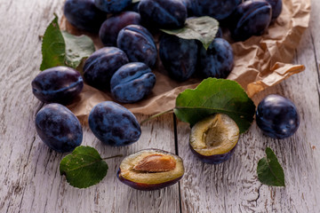 Fresh plums with leaves