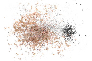 Fototapeta premium Wooden spiral pencil shavings from sharpener isolated on white background, top view