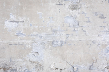 Fototapeta premium Damaged grey concrete wall exterior background texture