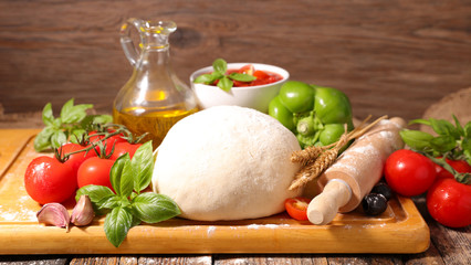raw pizza dough and ingredient