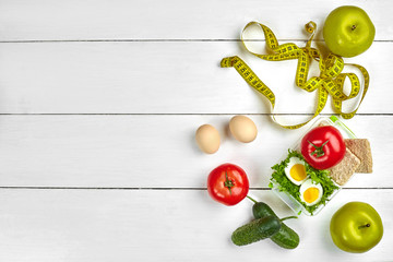 Naklejka na ściany i meble lunch box with healthy food. Eggs, vegetables, fruits.