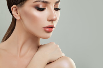 Beautiful young woman with clean skin. Girl beauty face care. Facial treatment.
