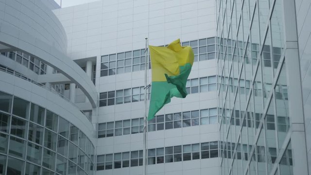 Slow motion of the flag of The Hague at the city hall. Shot in sixty frames per second on a twenty five frames variable frame rate.