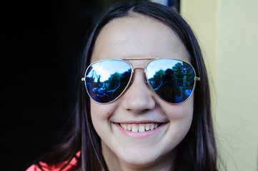 portrait of teen ager with mirrored glasses