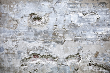 Damaged grey concrete wall exterior background texture