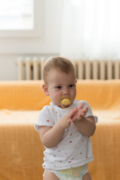 sequence photos of toddler climbing down and try to get off from bed. Baby development and self learning