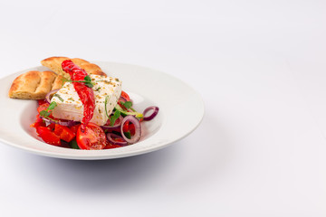 Top and Front View Isolated - Greek salad with onion, pepper, tomatoes, cucumber, donut, bread, feta cheese