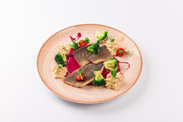 Top and Front View - Trout fillet in cornflakes, red beets broccoli and garlic sauce.