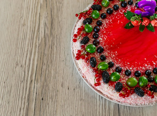 Delicious healthy vegetarian food, do not bake a strawberry cheesecake, decorated with fresh red berries and green mint leaves. Copy space