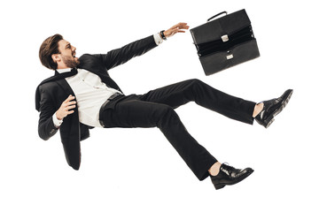 shouting young businessman falling with briefcase isolated on white