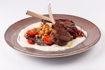 Front and Top view isolated - Lamb chops with tomato sauce sauce.