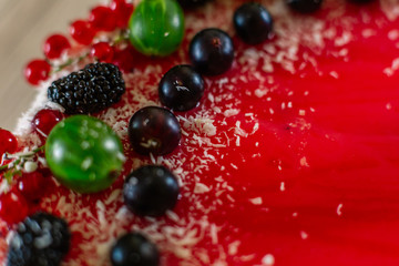 Delicious healthy vegetarian food, do not bake a strawberry cheesecake, decorated with fresh red berries and green mint leaves. Copy space