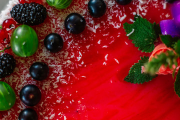 Delicious healthy vegetarian food, do not bake a strawberry cheesecake, decorated with fresh red berries and green mint leaves. Copy space