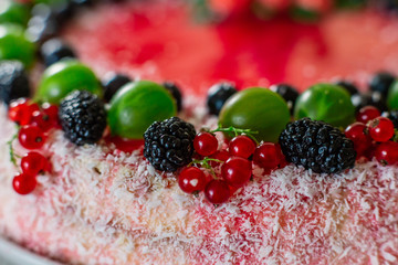 Delicious healthy vegetarian food, do not bake a strawberry cheesecake, decorated with fresh red berries and green mint leaves. Copy space