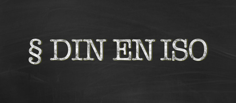 DIN EN ISO for german, european and international standard organization with chalk on blackboard background as banner