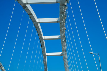 The navigable arch of the Crimean bridge. Arch of the highway and railway section of the Crimean bridge. Driving along the Crimean bridge. A grandiose building of the 21st century. The new bridge.