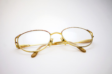 Eye glasses gold color on white background isolated